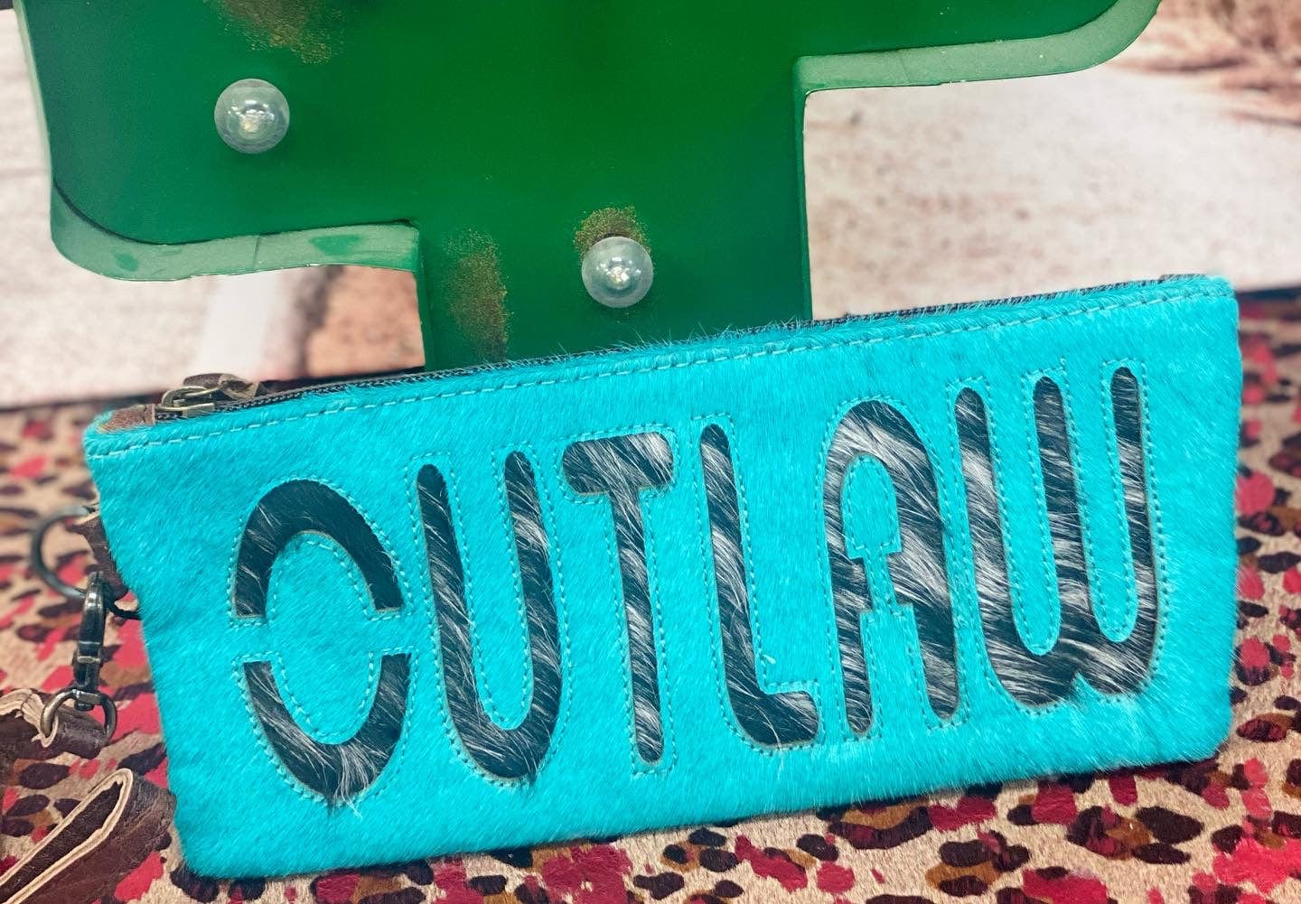 The Rodeo Cowhide Clutch Collection